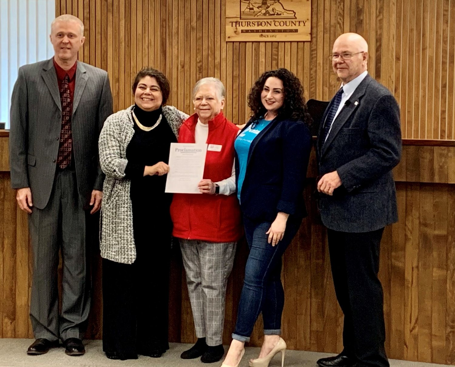 L-r: Thurston County Commissioners Tye Menser, Carolina Mejia, Zonta Club of Olympia representatives Pamela Dittloff and Lynda Nashed Zeman, and Commissioner Gary Edwards pose with Thurston Board of County Commissioners’ proclamation of Women’s History Month on March 22, 2022.